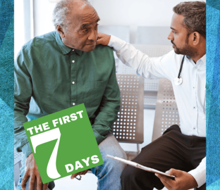 A doctor resting his hand on the shoulder of a senior man.