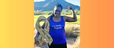 Voice of Hope Jaymie is flexing her arm and holding an awareness ribbon in the other