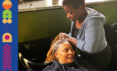 Stylist having a conversation while washing client's hair